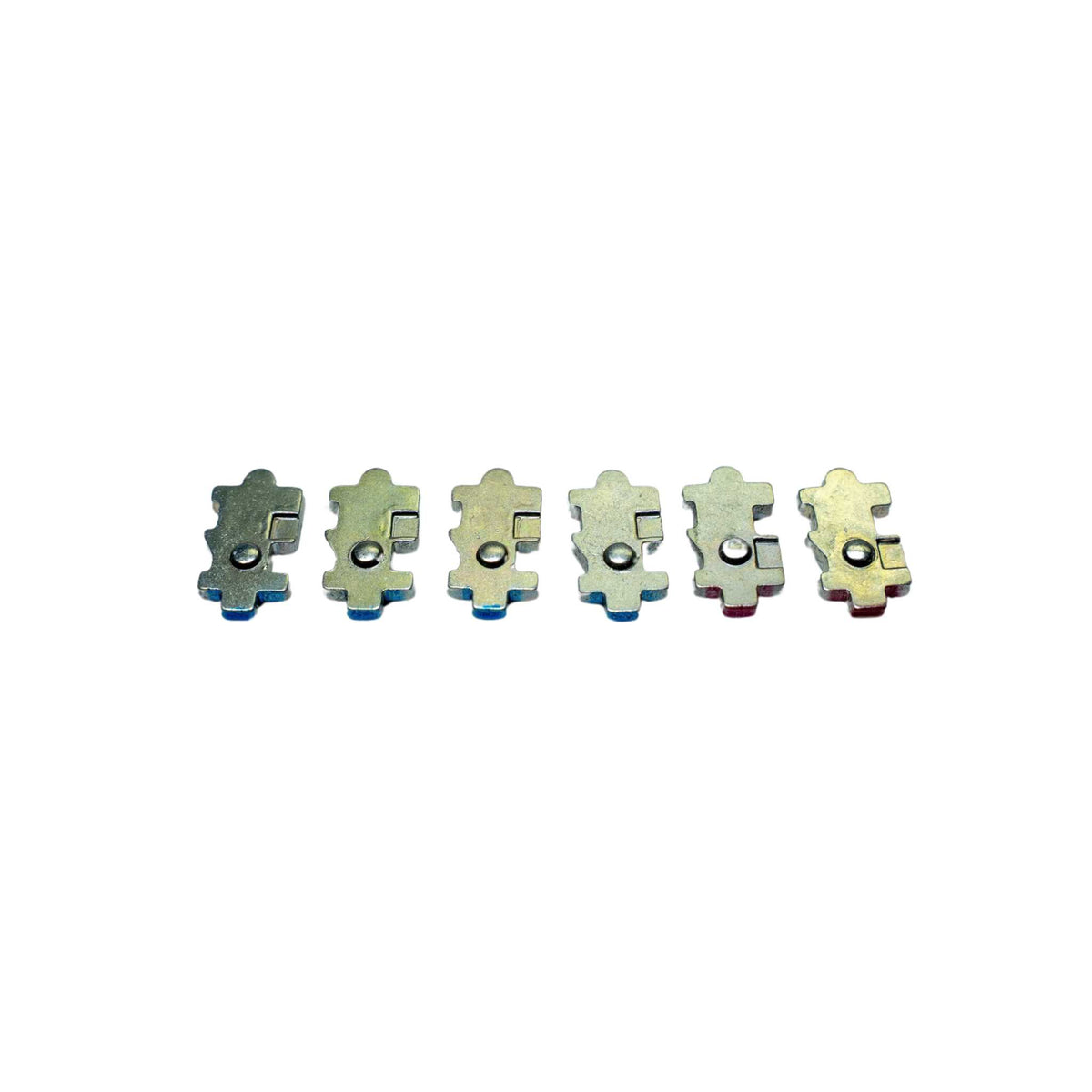 Set of six puzzle piece-shaped earrings on a white background