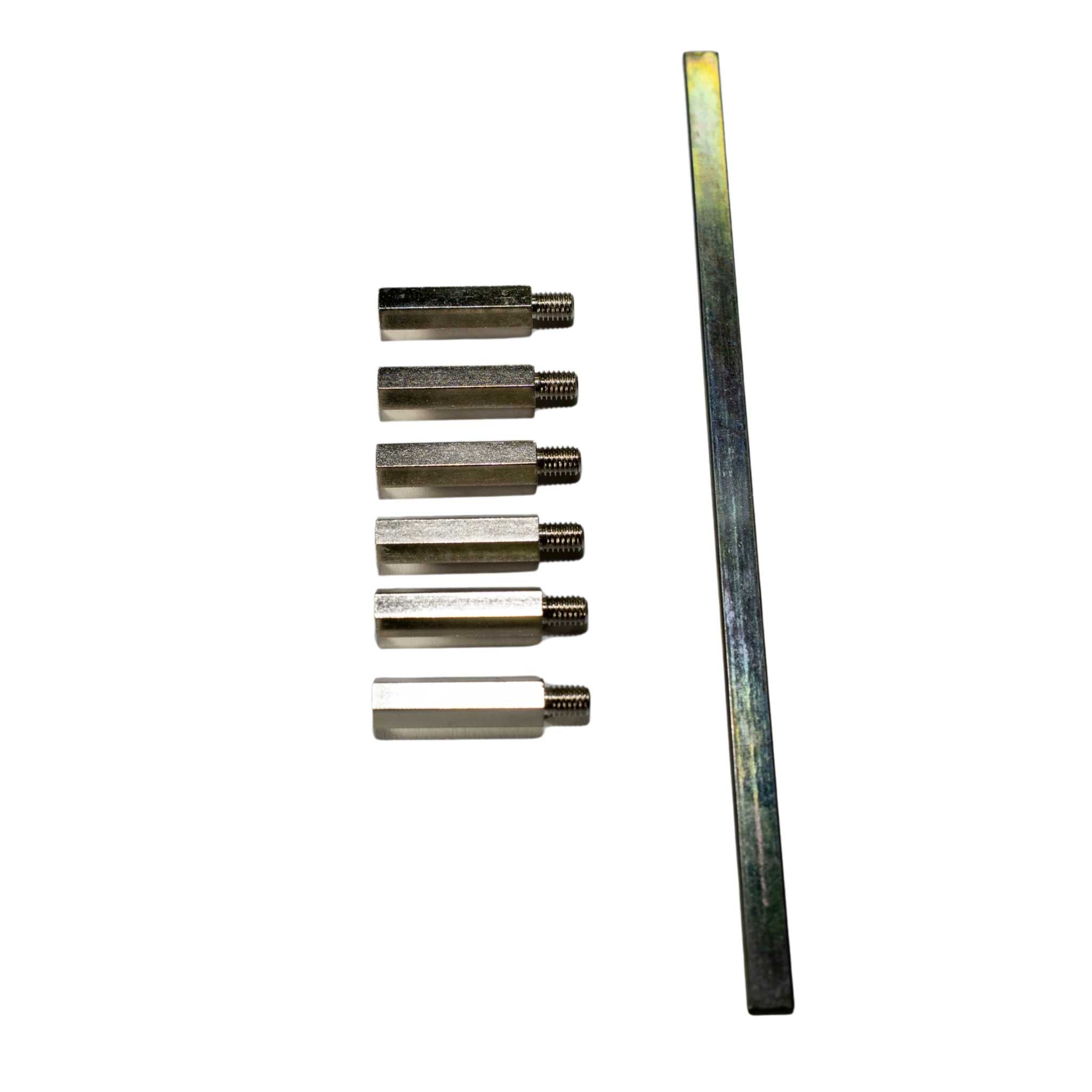 Set of metal tools including a long bar and six cylindrical components on a white background